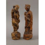 A pair of Chinese wooden figures. The largest 30 cm high.