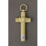 An ivorine angel headed communion cross. 17.5 cm high.