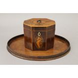 A George III mahogany octagonal tea caddy with shell inlay and a 19th century mahogany oval shell