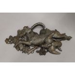 A Blackforest carved wooden wall hanging formed as a goat and a bird. 47 cm long.