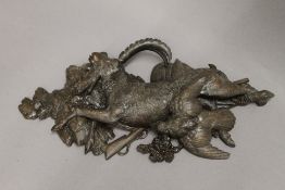 A Blackforest carved wooden wall hanging formed as a goat and a bird. 47 cm long.