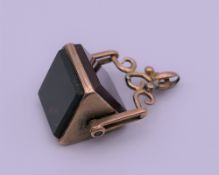 A 9 ct gold triangular swivel fob. 2.5 cm high. 7.1 grammes.