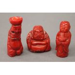 Three carved coral figures. The largest 5.5 cm high.