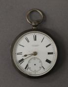 A silver pocket watch. 4.5 cm diameter.