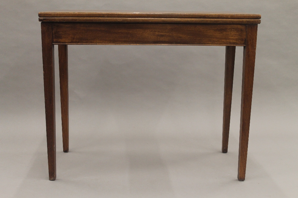 A 19th century mahogany fold over tea table. 91 cm wide. - Image 2 of 10