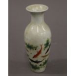 A small Chinese porcelain vase decorated with fish. 16.5 cm high.