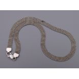 A silver necklace. 39 cm long. 15.5 grammes.