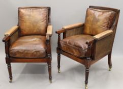 A pair of Bergere armchairs, with leather padded arms leather covered removable cushions.