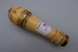 A 19th century piquet inlaid ivory handle. 11.5 cm high.