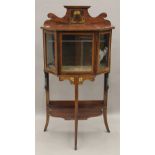 An Edwardian mahogany display cabinet. 111 cm high x 56 cm wide.