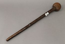 A Zulu club with ribbed ball end, the wood with fine patination. 57 cm long.