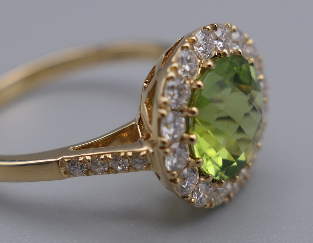 An 18 ct gold, peridot and diamond ring with diamond shoulders. Ring Size M. 3. - Image 6 of 6