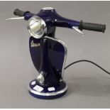 A Vespa form table lamp. 32.5 cm high.