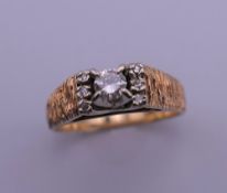 A 14 ct gold diamond ring. Ring size L/M. 4.2 grammes total weight.