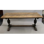 An early 20th century oak refectory table and six chairs. The table 180 cm long.