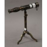 A telescope on stand. 23 cm long.
