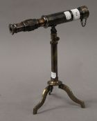 A telescope on stand. 23 cm long.