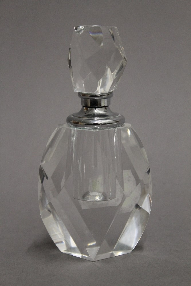 A cut glass scent bottle. 12 cm high.