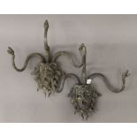 A pair of bronze wall sconces formed as Medusa. Each 34 cm wide.