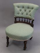 A Victorian upholstered walnut nursing chair. 52 cm wide.