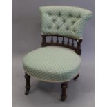 A Victorian upholstered walnut nursing chair. 52 cm wide.