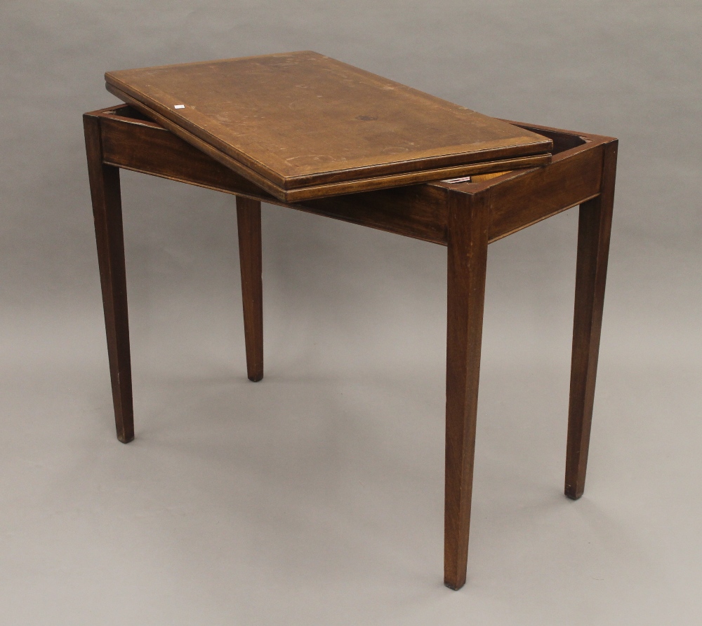 A 19th century mahogany fold over tea table. 91 cm wide. - Image 4 of 10