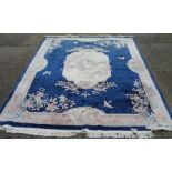 A large Chinese blue ground carpet. 366 x 276 cm.