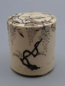 A 19th century shibayama ivory inlaid cylindrical box. 5.25 cm high.