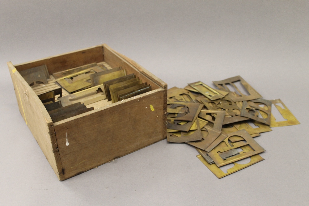 A quantity of late 19th/early 20th century brass printer's stencils