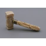 A 19th century carved ivory miniature gavel. 8.5 cm high.