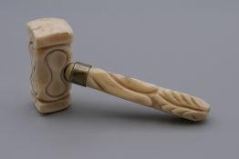 A 19th century carved ivory miniature gavel. 8.5 cm high.