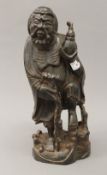 A Chinese carved figure of an immortal. 38.5 cm high.