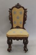 A 19th century carved walnut side chair. 51 cm wide.