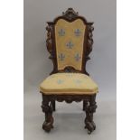 A 19th century carved walnut side chair. 51 cm wide.