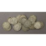 Twenty silver three-pence coins