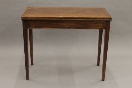 A 19th century mahogany fold over tea table. 91 cm wide.