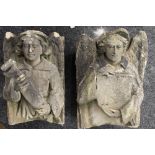 A pair of Antique carved stone corbels formed as angels.