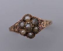 An Antique 12 ct gold seed pearl ring. Ring Size R/S. 1.6 grammes total weight.