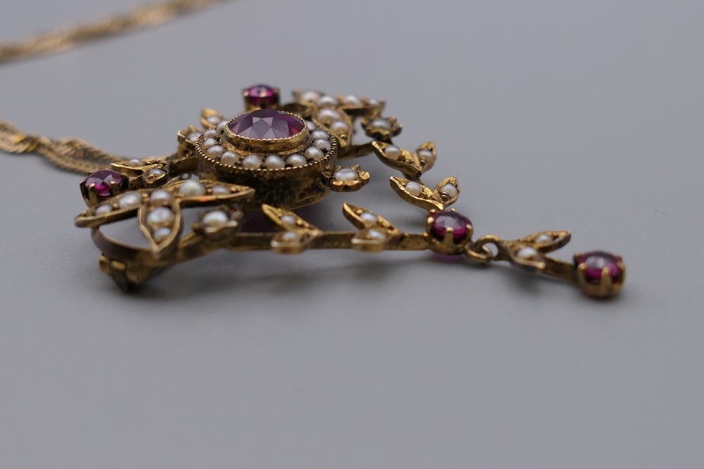 An Edwardian 9 ct gold seed pearl and red stone set pendant, on 9 ct gold chain. The pendant 4. - Image 3 of 5