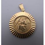 A 9 ct gold St Christopher pendant. 6.4 grammes.