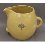 A large Victorian Armorial pottery jug. 35 cm high.