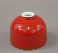 A red beehive porcelain brush pot. 7.5 cm high.