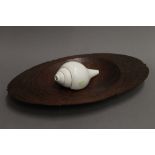 A South Sea carved wooden food dish and an engraved conch shell horn. The bowl 48 cm wide.