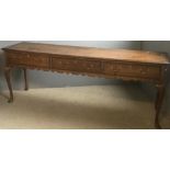 An 18th century oak low dresser. 204 cm wide, 51 cm deep, 81.5 cm high.