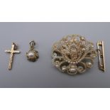 A Victorian seed pearl set brooch in a tooled leather box,