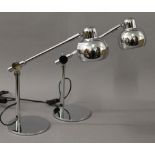 A pair of chrome anglepoise lamps