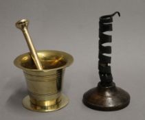 An 18th century brass bell shaped pestle and mortar,