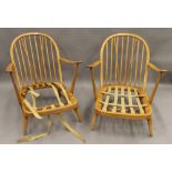 A pair of blonde Ercol lounge chairs. 70 cm wide.