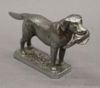 A car mascot formed as a retriever. 10 cm high.