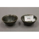 A pair of small Chinese bronze bowls. 6 cm diameter.